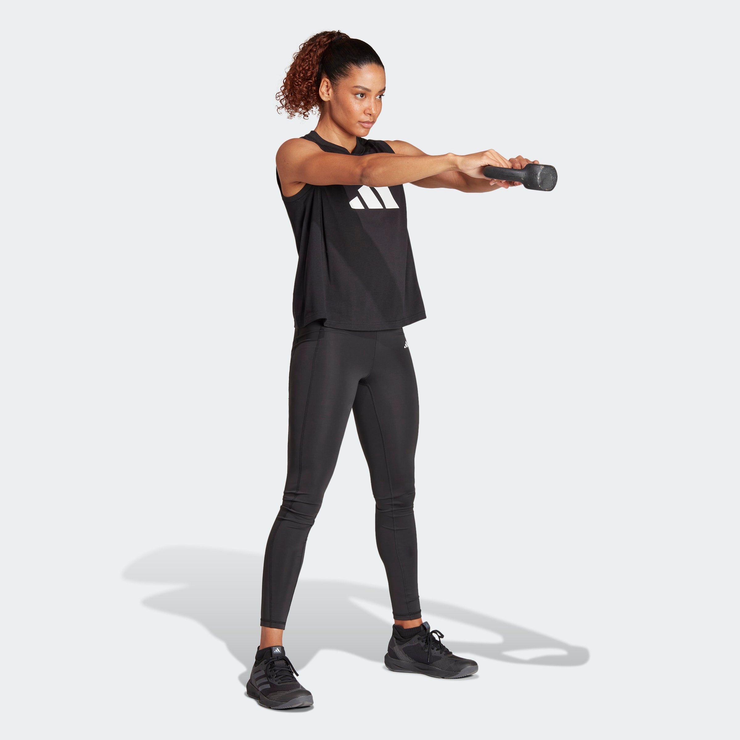 Womens Train Essentials Logo Tanks